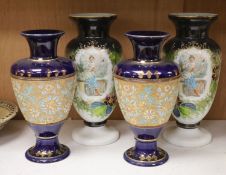 A pair of Doulton Slater stoneware vases and a pair of opalescent glass vases, height 37cm