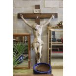 A large composition and oak crucifix, width 126cm, height 218cm