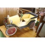 A child's tinplate pedal car, length 94cm