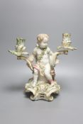 A large German porcelain 'Cupid' candelabrum, late 19th century, height 30cm