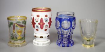A group of 19th century Bohemian and German glass beakers, a wheel engraved blue overlaid glass