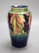 A Moorcroft leaf and berry vase, height 21cm