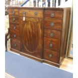 A George III line-inlaid mahogany breakfront side cabinet, fitted with an arrangement of eight short