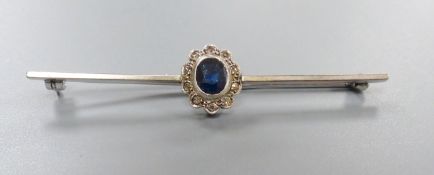 An early 20th century white metal , sapphire and diamond cluster set bar brooch, 58mm, gross 3.3