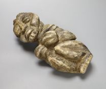 A South American carved stone figure, length 30cm