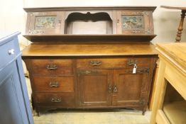 An Arts & Crafts style oak sideboard with stained glass dolphin panels, length 182cm, depth 60cm,
