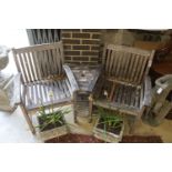 A weathered teak garden love seat, length 155cm, depth 70cm, height 88cm