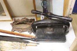 A Victorian cast iron book press and boot scraper