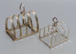 A Gothic design silver four division toast rack , 76mm and another smaller four-division toast rack,