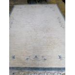 A Chinese beige ground carpet, 340 x 250cm