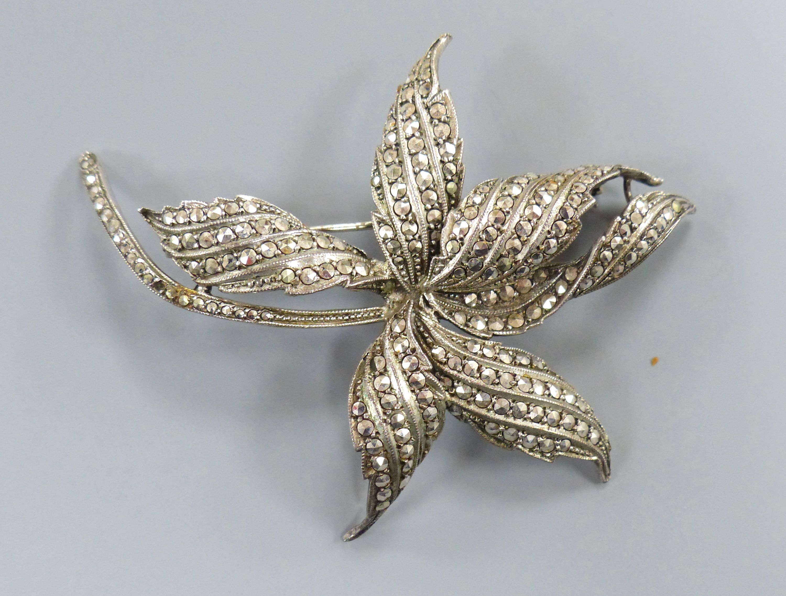 A 1960's silver and marcasite floral spray brooch and a lady's silver and marcasite wrist watch. - Image 4 of 5