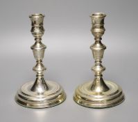 A pair of George II style silver presentation candlesticks, weighted, London 1986, 18.3cm, David