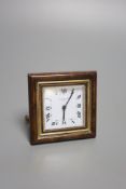 A gilt metal and faux tortoiseshell mounted Cartier travelling clock, with red Cartier pouch (