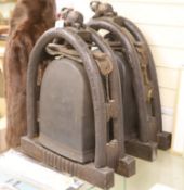 A pair of Eastern bronze elephant bells, each mounted within a carved arched hardwood frame with
