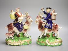 A pair of Derby figures, Welsh Tailor and Companion figures both figures seated on a goat, the