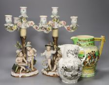 A pair of Continental porcelain floral figural three light candelabra, height 34cm, a Crown Devon