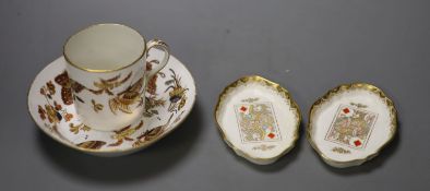 A 19th century Wedgwood coffee can and saucer painted and gilded with butterflies or moths, marked
