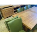 A contemporary oak dining suite, comprising a refectory style extending dining table on heavy 'H'