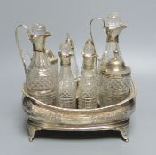 A George III silver cruet stand, with six matching cruets, London 1808, and two associated cruets,