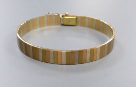 A modern three colour 9kt bracelet, 18cm, 19.6 grams.