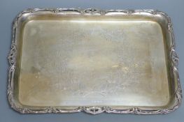 An Edwardian rectangular engraved silver tray with pierced scroll-decorated border, London 1908,