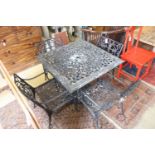 A Victorian style square cast metal garden table, width 88cm, height 72cm and four elbow chairs (one