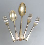 A Georgian Newcastle silver table spoon, three George III silver dessert forks and a later dessert