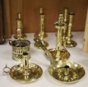 A quantity of 18th/19th century brass ejector candlesticks together with chambersticks, tallest