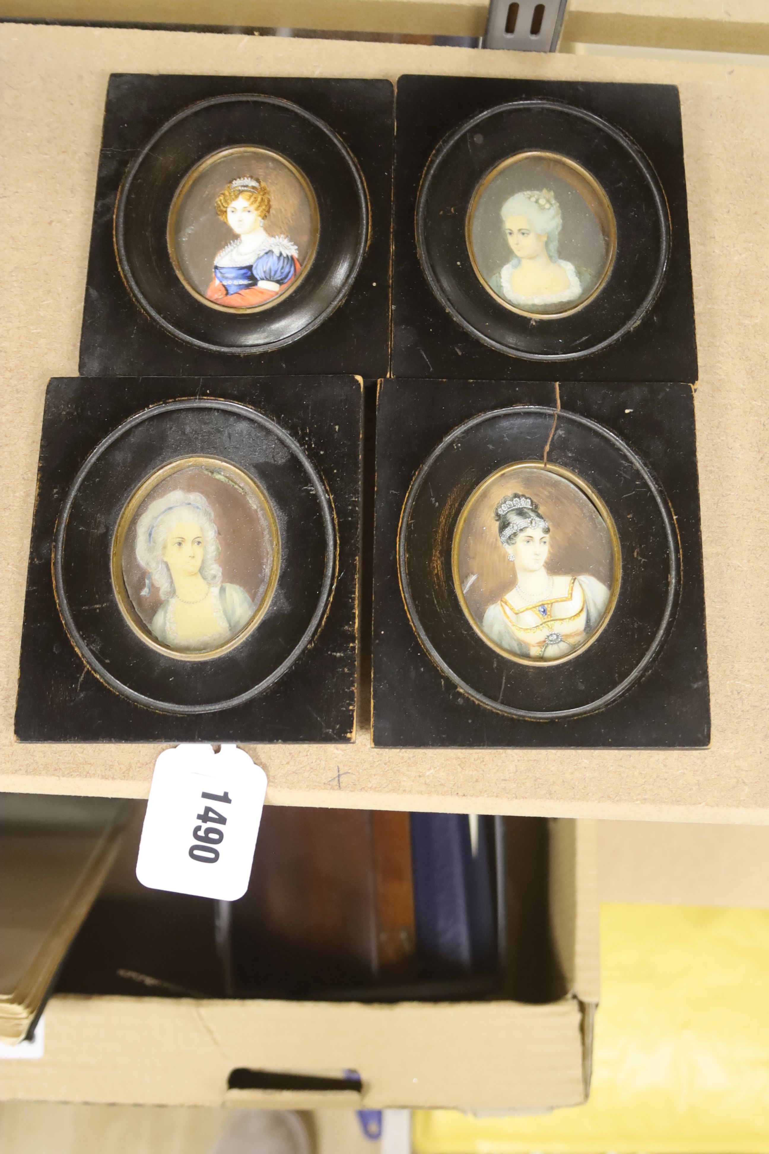 Four 19th century portrait miniatures on ivory