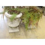 A pair of reconstituted stone campana garden urns on stands, diameter 36cm, height 45cm