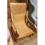 A caned hardwood plantation chair, width 59cm, depth 86cm, height 98cm
