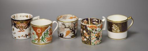 Five English coffee cans, two Derby with different imari patterns, a New Hall can with fruiting