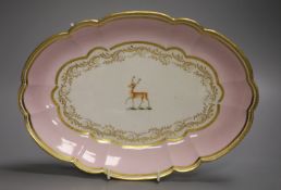 A Barr Flight and Barr pink ground oval dish with elaborate gilding and a family crest of a stag,