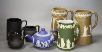 A 19th century Wedgwood teapot and jug, two black basalt jugs and a mug and two drabware jugs,