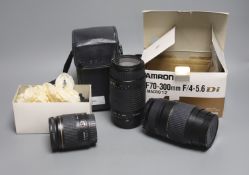 A Tamron AF70-300mm F/4-5.6 Di LD Macro 1:2 camera lens, a Sigma DL Zoom lens and a Canon 28-80m