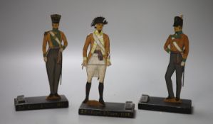 Three fret-cut wooden Military figures, tallest 18cm