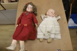 Armand Marseille bisque doll, 390 A5M, with sleeping eyes and open mouth and a similar baby doll