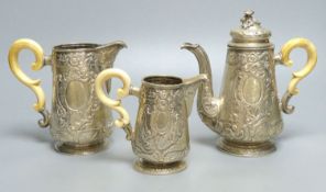 A late 19th/early 20th century Austro-Hungarian embossed 800 standard white metal three piece tea
