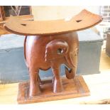 An Ashanti carved elephant stool, width 55cm, depth 26cm, height 58cm