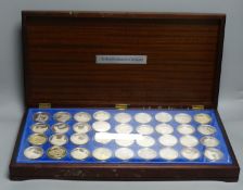 A cased set of 36 silver 'The Beauty of British Churches' medallions, one medallion weighs 45