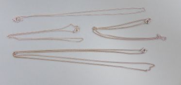 Four assorted white metal finelink chains, stamped 9ct, gross 12.6 grams.