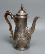 An early George III silver coffee pot, with later embossed decoration, maker ?D over WI, of baluster