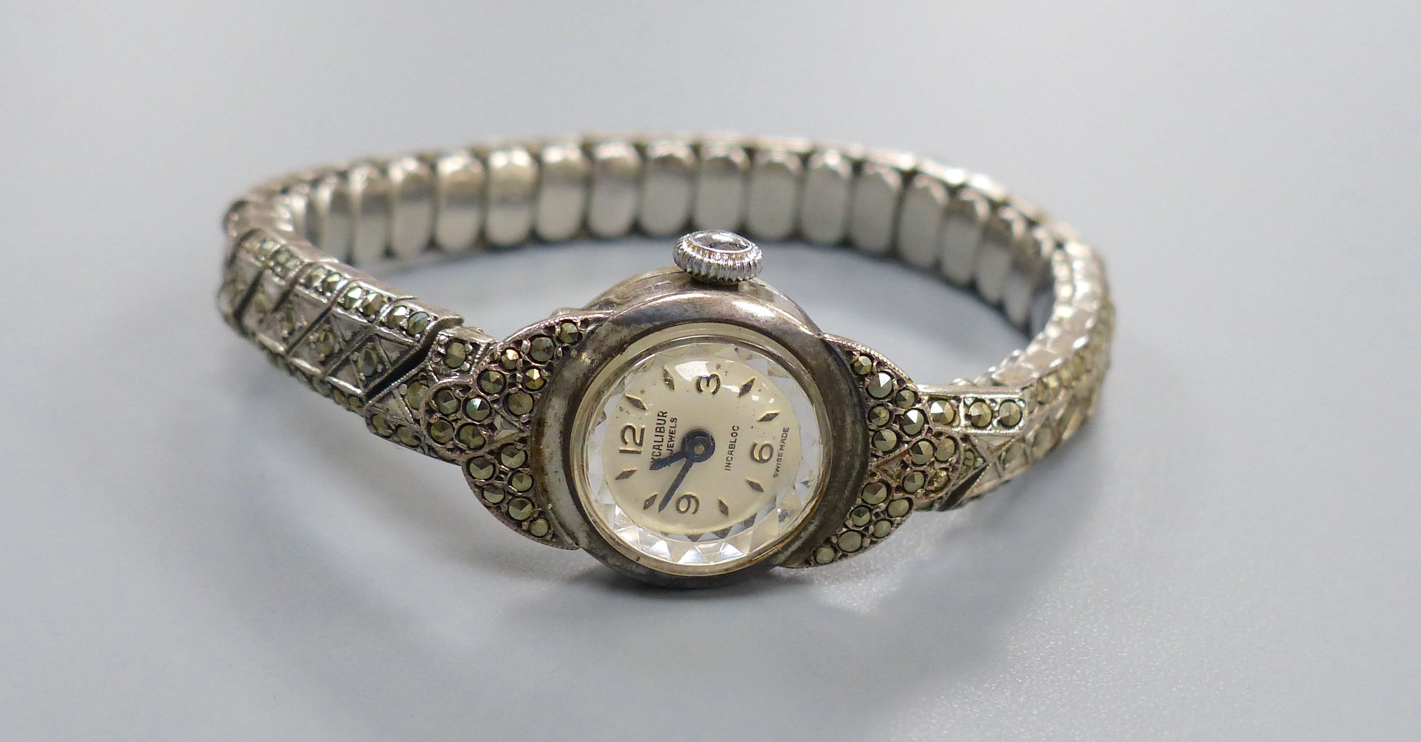 A 1960's silver and marcasite floral spray brooch and a lady's silver and marcasite wrist watch. - Image 2 of 5