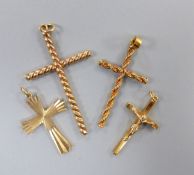 Four assorted modern 9ct gold cross pendants, largest 43mm, gross 8.8 grams.