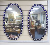 A pair of Irish style shaped oval wall mirrors, width 40cm, height 70cm