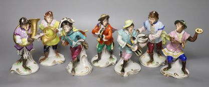 Seven German porcelain monkey band figures, height 15cm