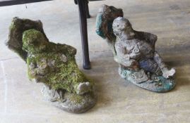 A pair of reconstituted garden ornaments modelled as seated gnomes, height 40cm