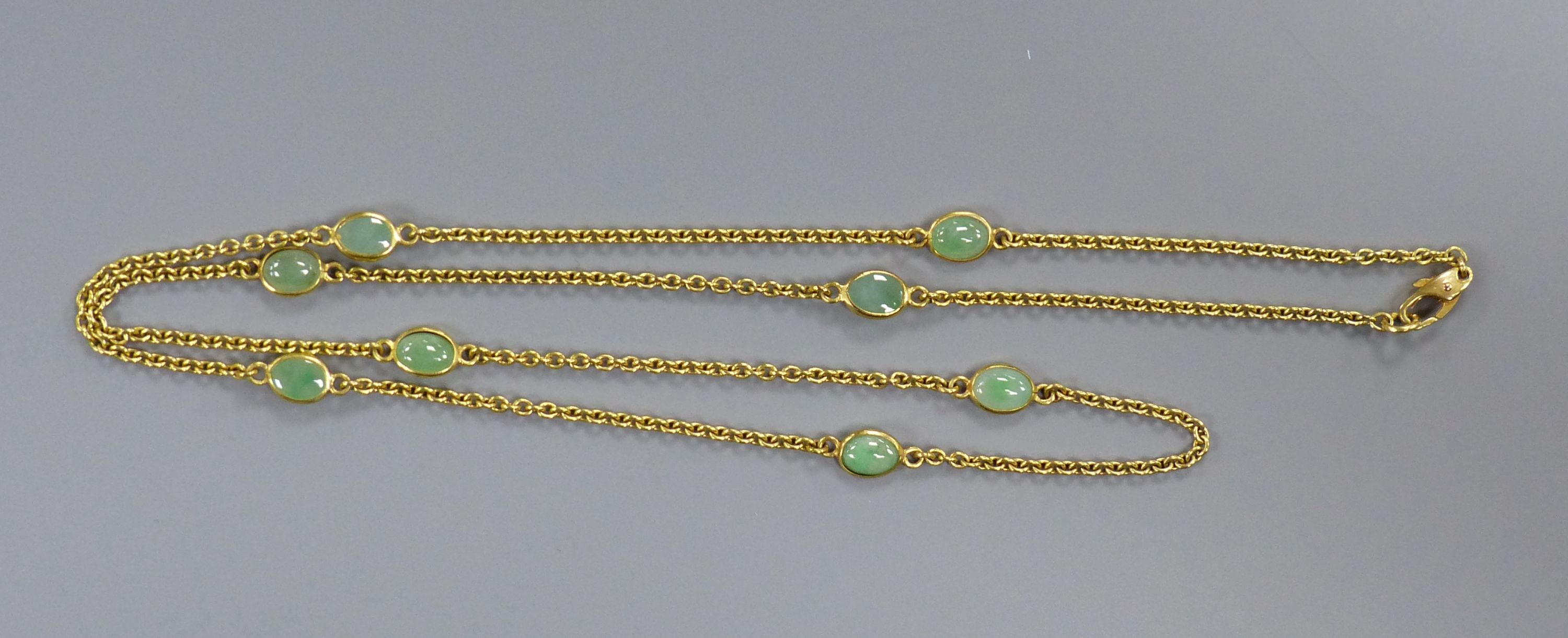 A modern 9ct gold and eight stone cabochon jade set 'spectacle' necklace, 60cm, gross 9.1 grams. - Image 2 of 3