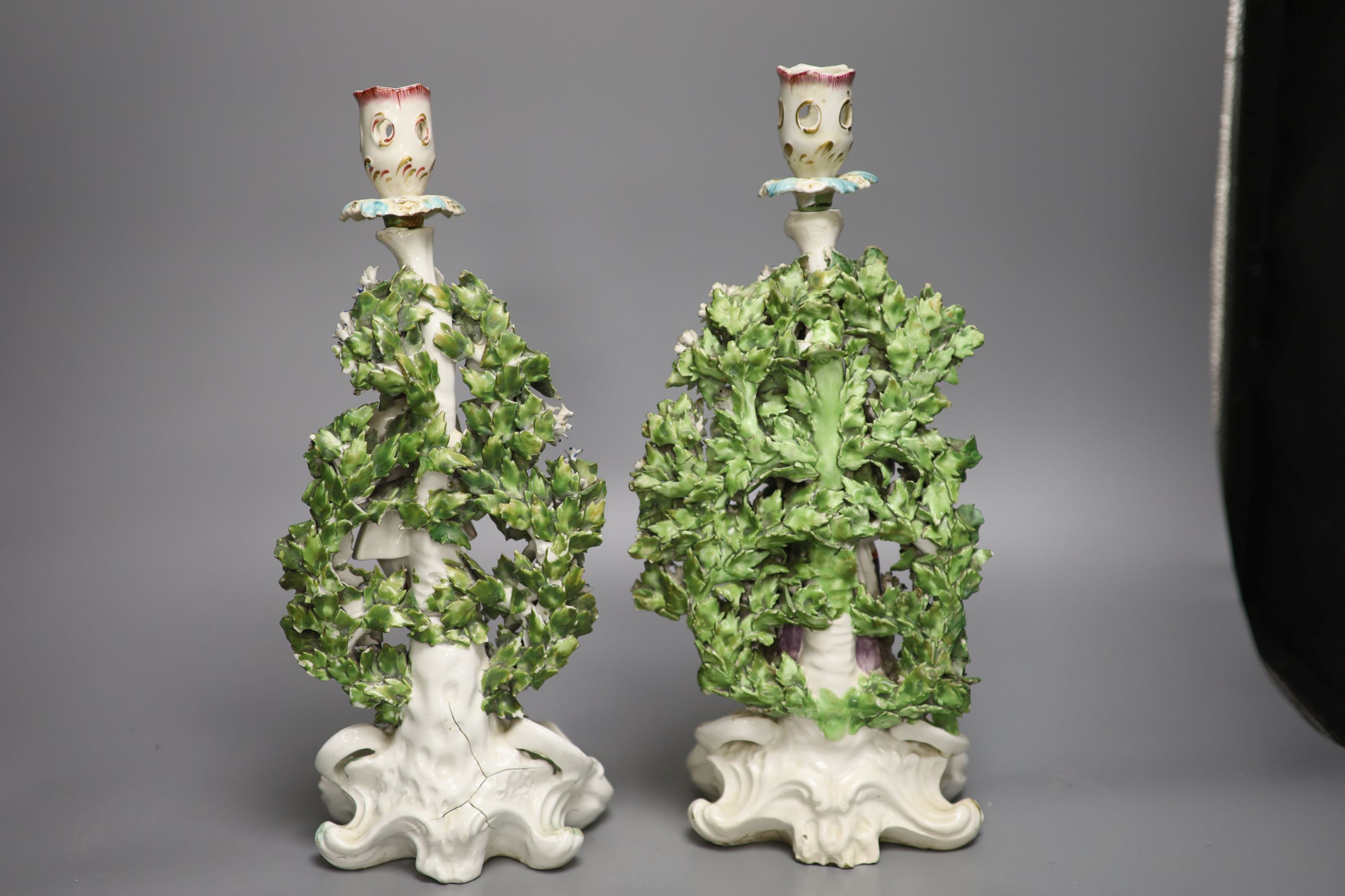 A pair of Derby candlestick figures of the Italian Farmer and wife, he holding a rooster, and her - Image 3 of 5