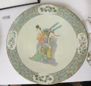 A Chinese enamelled porcelain 'immortals' dish, 19th century, diameter 38cm, restored